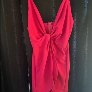 Pink Short Romper with stomach out.